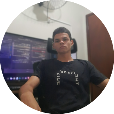 A photo of me sitting on my chair with a monitor display code behind me